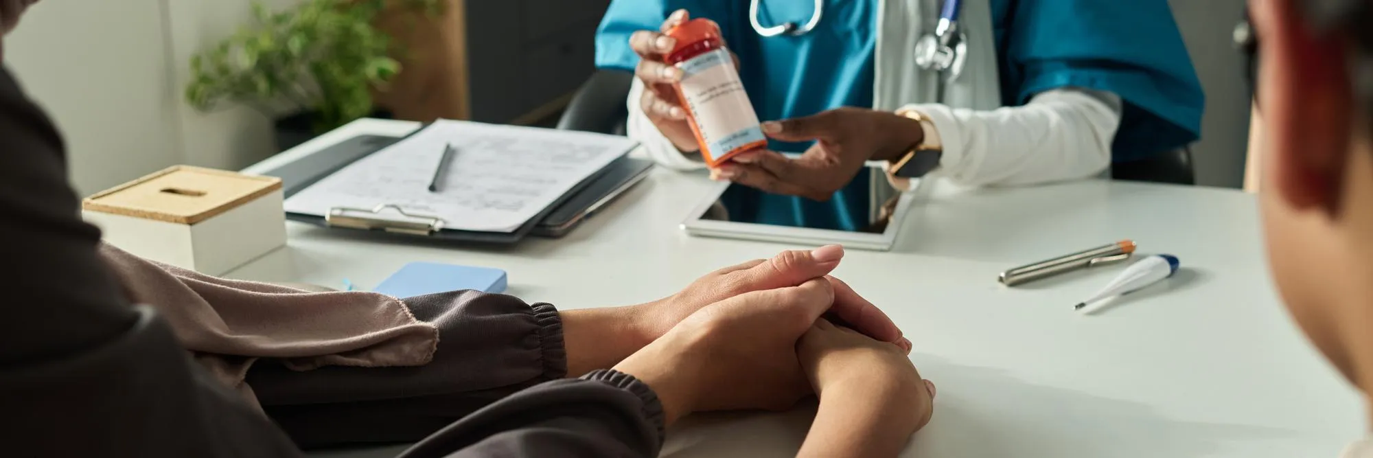 Healthcare provider discussing medication and patient care during a remote health monitoring solution.