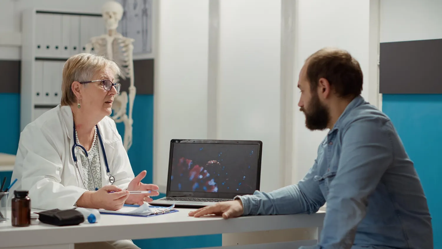 Healthcare provider discussing patient information during remote patient monitoring services.