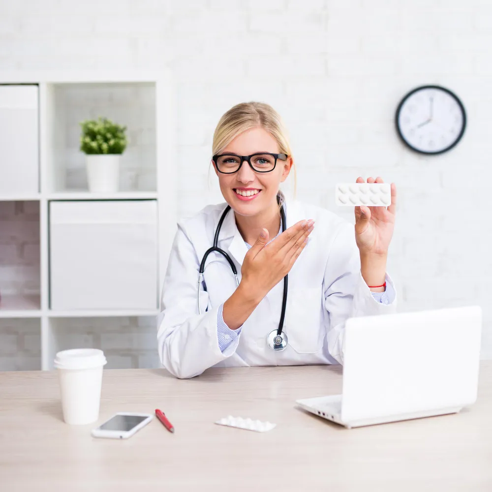 Pharmacist discussing prescription medication with a patient through pharmacy medication management services.