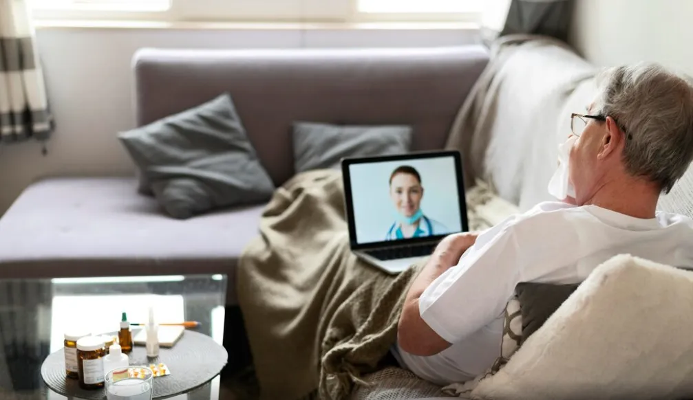 Senior patient attending virtual healthcare appointment for diabetes management through remote patient monitoring services