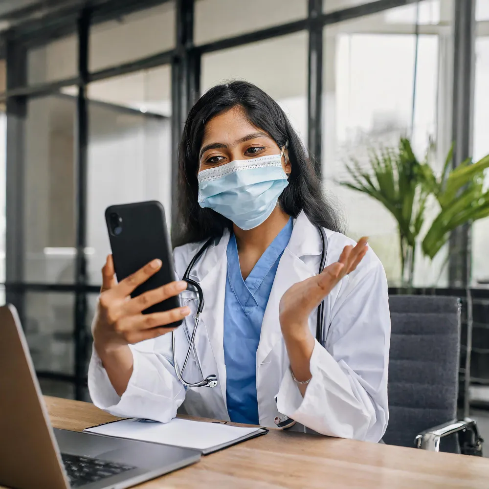 Healthcare professional using mobile technology to provide health monitoring solutions and Remote Patient Monitoring