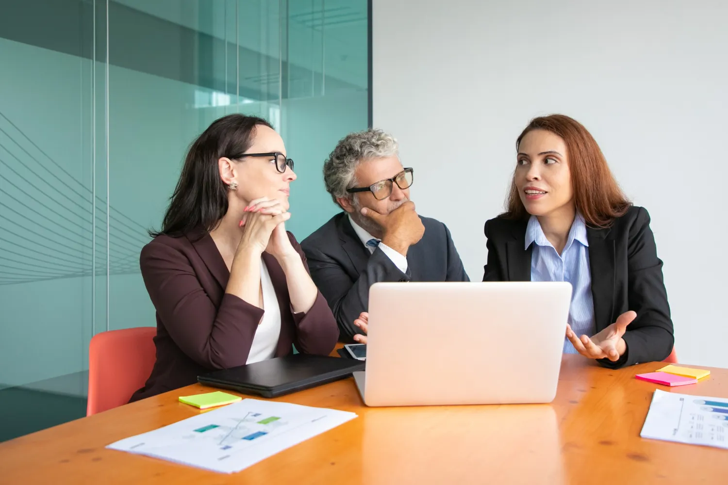 Team discussion around analytics and performance metrics, highlighting expert MIPS consulting services provided by leading healthcare consulting firms
