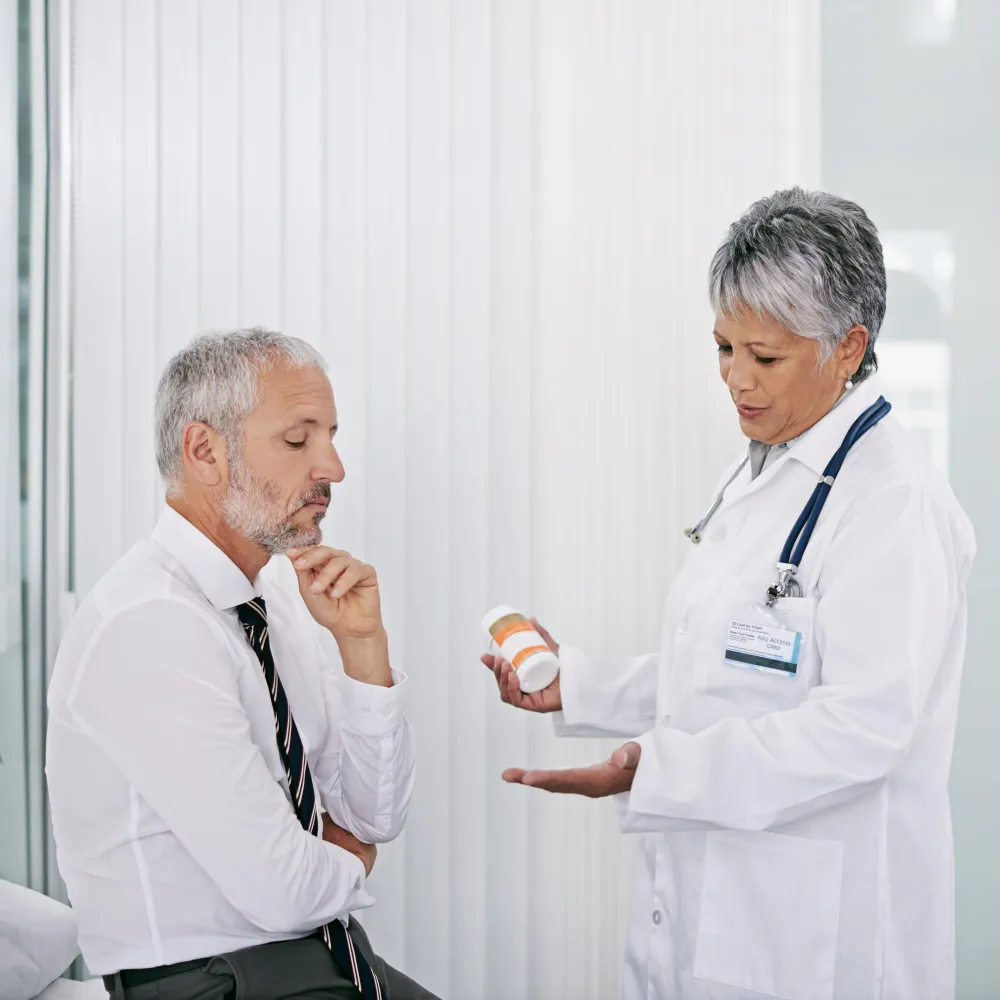 Healthcare provider explaining treatment plan and patient monitoring strategies under principal care management services