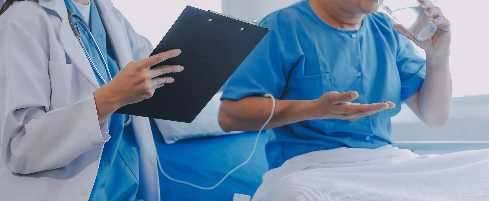 Healthcare provider monitoring patient treatment and medication intake to ensure continuity of care and effective transitional care support