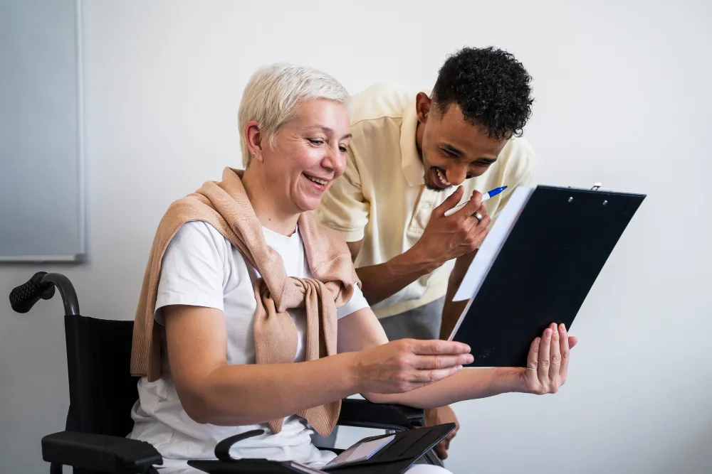 Transition Care Management assisting senior patient with post-discharge care plan and follow-up instructions
