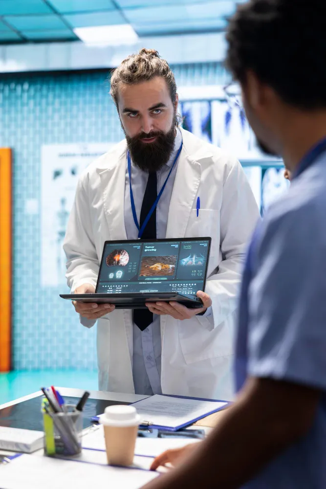 Healthcare professional using digital tools to review patient data for remote patient support and monitoring