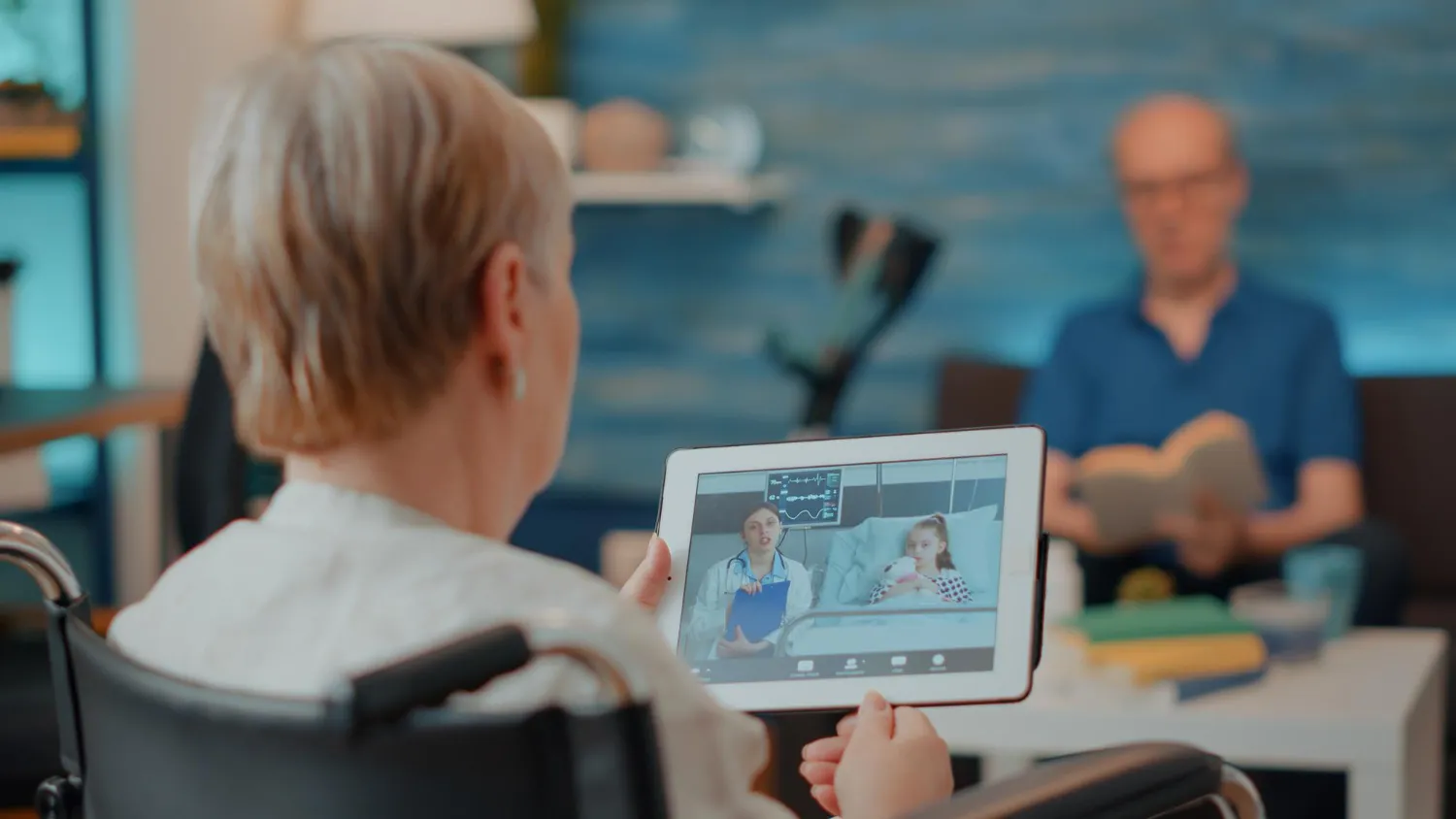 Patient using a tablet for a virtual consultation from home, showcasing Digital Health Telemonitoring Devices and remote care solutions that enable continuous monitoring and convenient healthcare access