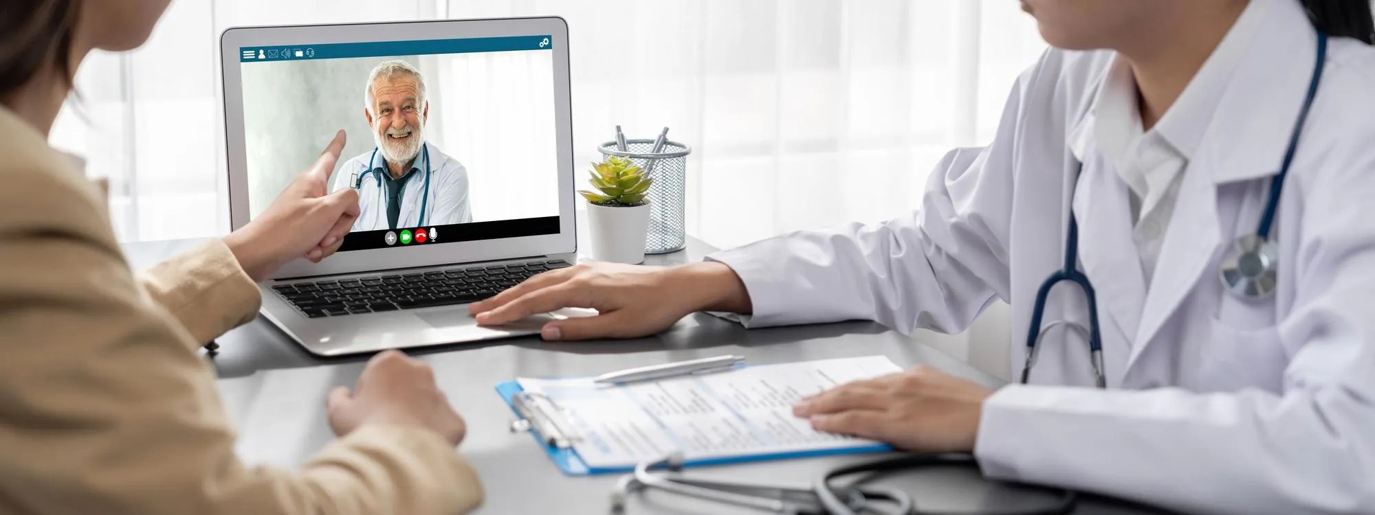 Patient discussing a care plan during a virtual appointment as part of a Remote Patient Monitoring Program with Remote Patient Support Services.