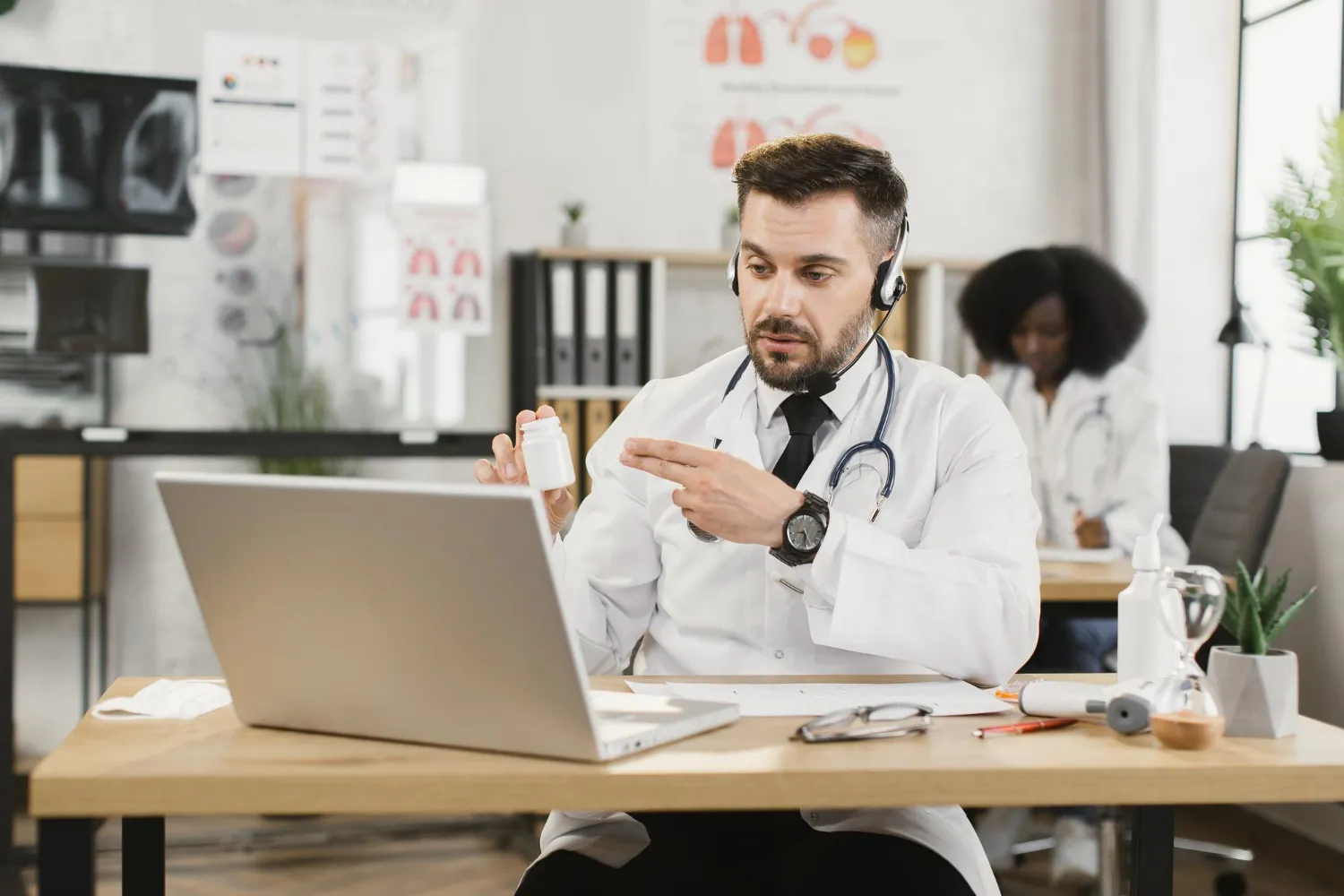 Healthcare provider using a tablet to document remote patient monitoring services.