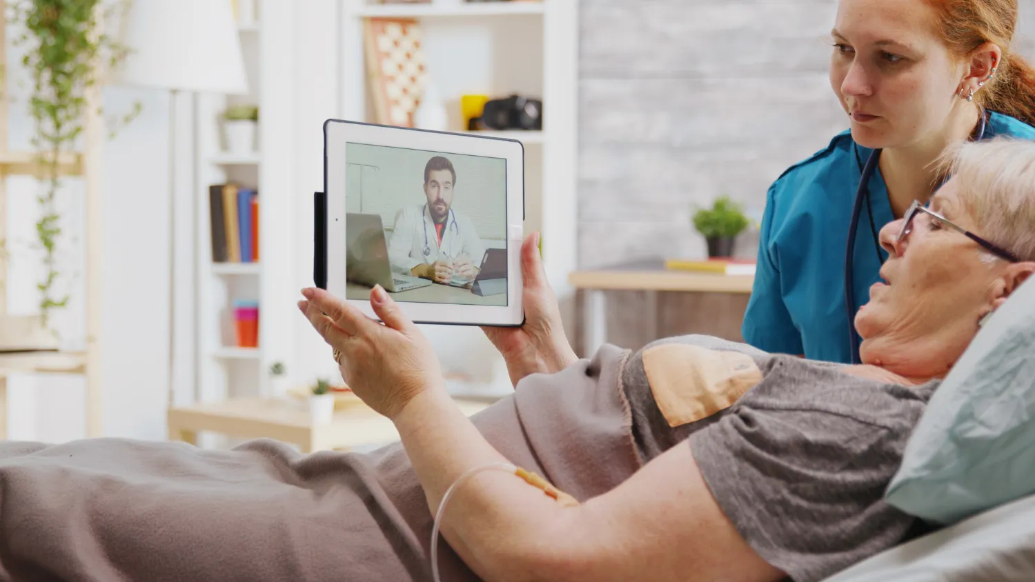 Elderly patient receiving remote patient monitoring services through a telehealth consultation.